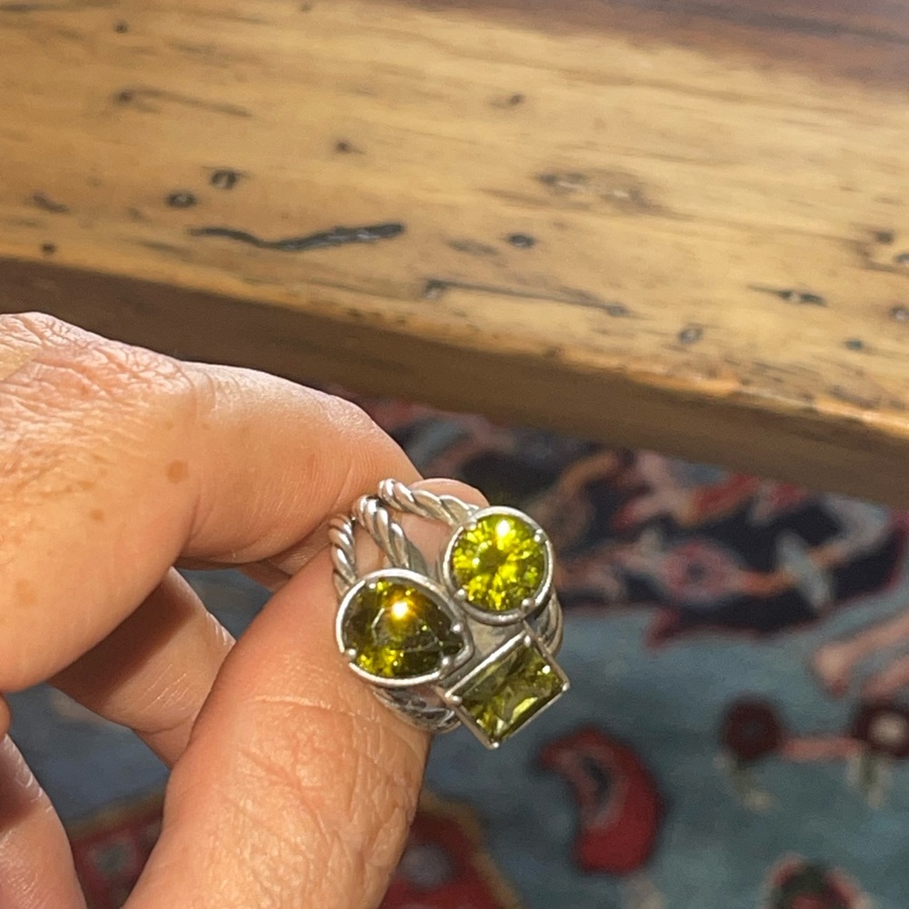 950 Silver ring with yellowish-green stones….maybe peridot?